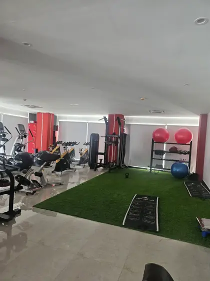 Turf area with red pillars and mirrors